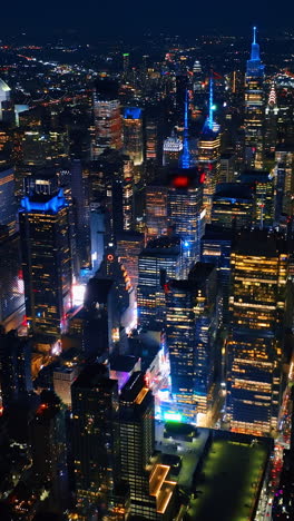 cityscape sparkling with billions of lights. majestic new york panorama at night. aerial perspective. vertical video