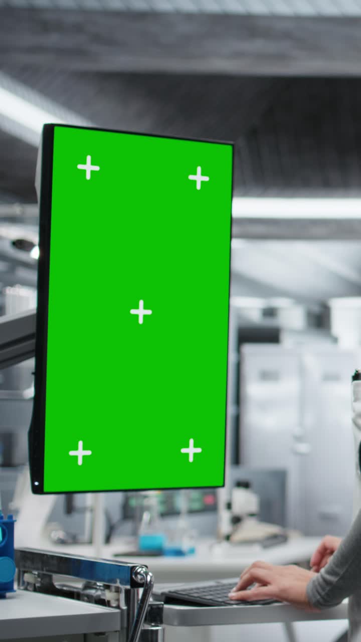 Vertical Video Chroma key in vertical position next to nurse observing new drug testing