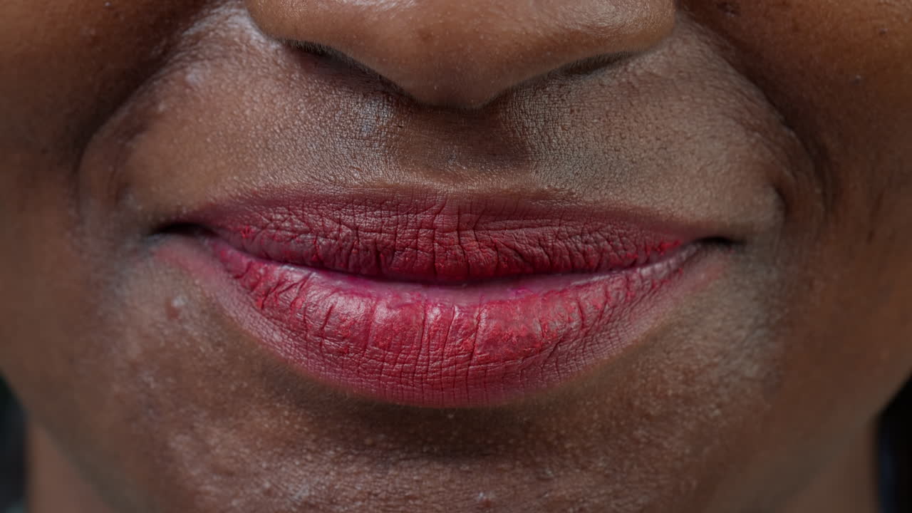 Macro shot of female model showing candid smile on camera