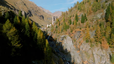 Aerial-Revealed-Diga-del-Gleno-Over-Creek-In-The-Valle-di-Scalve,-Northern-Province-of-Bergamo,-Italy