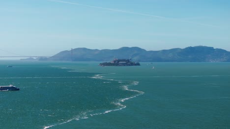 drone shot over the san francisco bay showing alcatraz island during the day