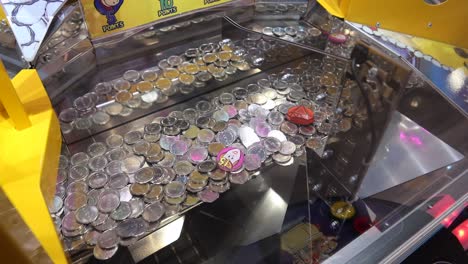 prize machine with coins and buttons