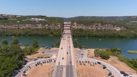 establishing drone shot of the pennybacker bridge in austin, texas