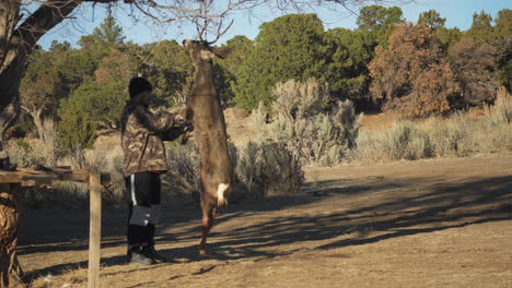 hunter begins to process his buck kill