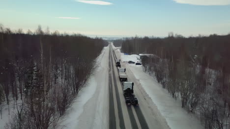 snowy highway with trucks