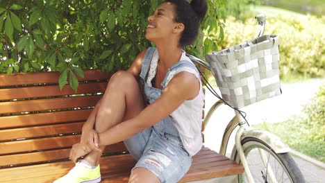 model posing in park on bench