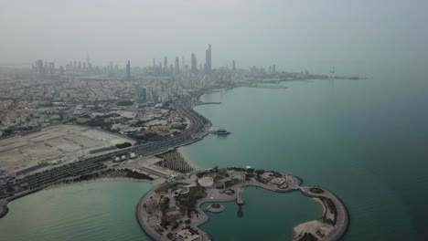 kuwait city waterfront (arabian gulf). skyline panoramic view, overcast weather. slow forward dolly shot