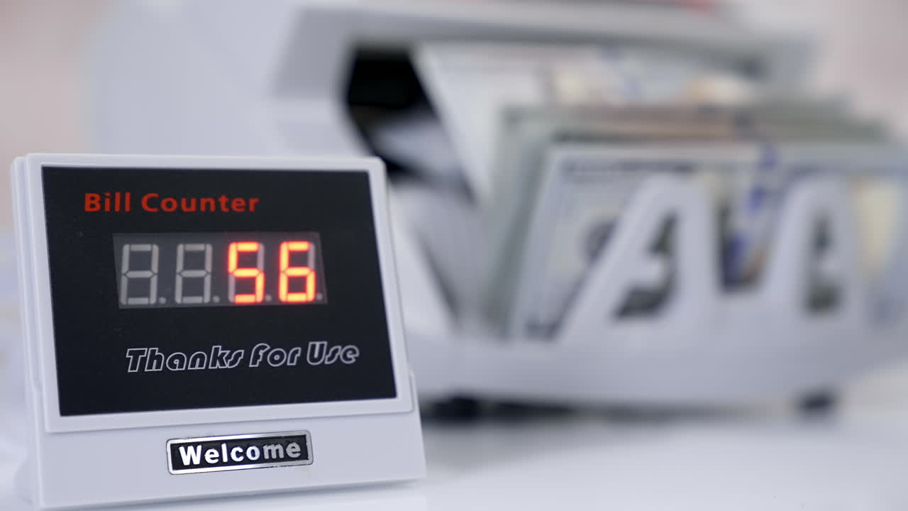US dollar banknote in counting machine. Automatic mechanism for bank financial operations.