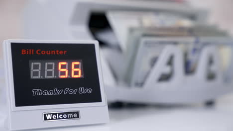 us dollar banknote in counting machine. automatic mechanism for bank financial operations.