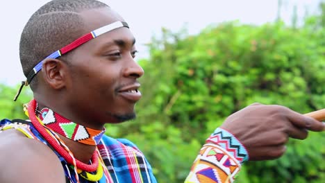 African-man-jamming,-nodding-head,while-listening-to-music-in-Kenya,-Africa