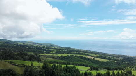 aerial of sky with dramatic cloud above green