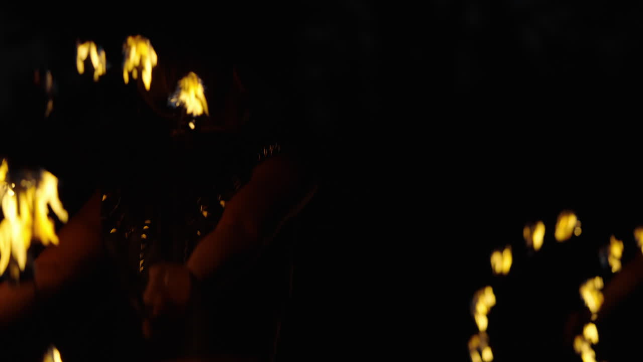 Fire Juggler Performance at Night