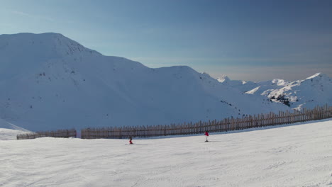 Aerial-View-Of-Skiers-On-The-Slope-Of-Ski-Resort-In-Saalbach-Hinterglemm,-Austria---Drone-Shot