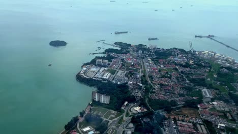 a coastal cityscape with ships at sea and clear skies, early morning light, aerial view