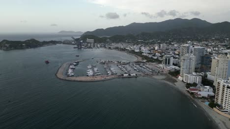 santa marta colombia caribbean sea ocean drone aerial view rodadero hotel skyscraper building an port with boat