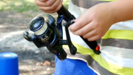 child holding a fishing rod
