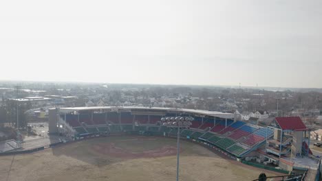 mccoy stadium in pawtucket rhode island, wide drone shot of abandoned stadium, aerial