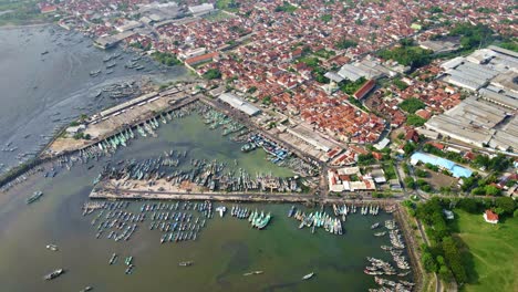 aerial footage portrays the polluted waters of muncar fishing port, java's largest