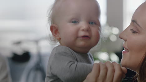 close up business woman mother with baby daughter at work playful toddler enjoying loving mom successful motherhood in office workplace