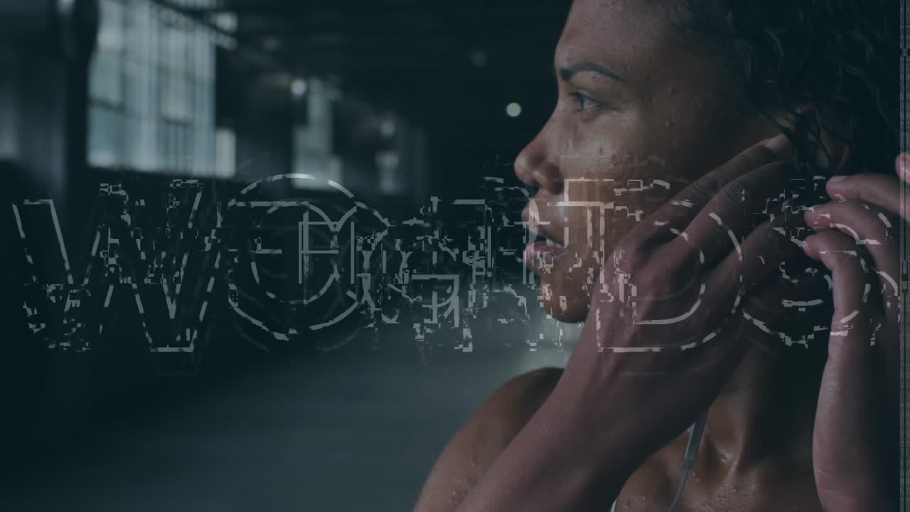 Animation of fight text over african american sportswoman wearing earphones