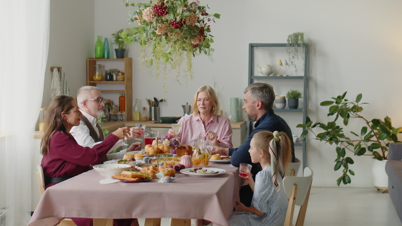 Big Family Toasting at Holiday Home Dinner