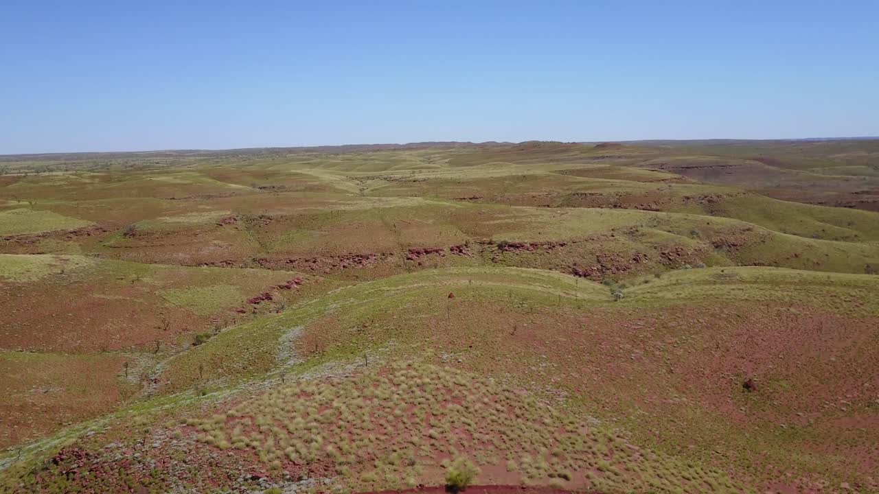 A flyby of a hill with people on it in the Pilbra region of Western Australia