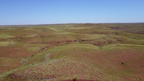 a flyby of a hill with people on it in the pilbra region of western australia