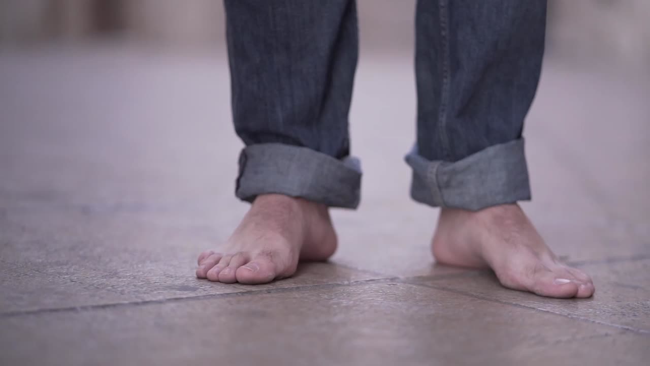Barefoot Person Walking on Stone Floor