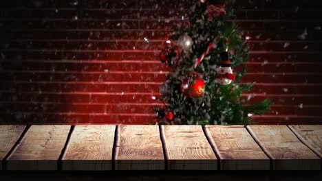 wooden foreground with christmas background of tree and snow