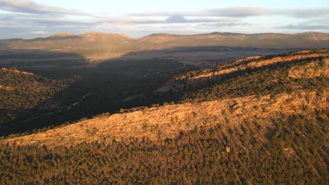 Topdown-view-Jarvis-hill-lookout-hitted-by-sunrise-lights,-Rock-formation-on-mountain