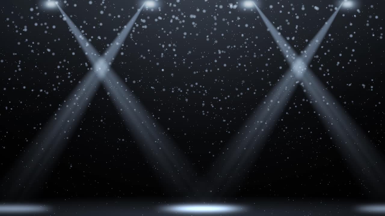 Spotlights moving amidst floating gray particles