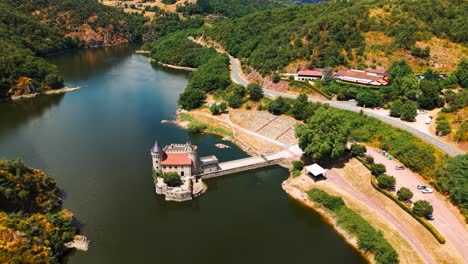 aerial shot above the chateau de la roche revealing the loire river and the landscape behing near roanne in loire departement, auvergne rhone alpes region, france