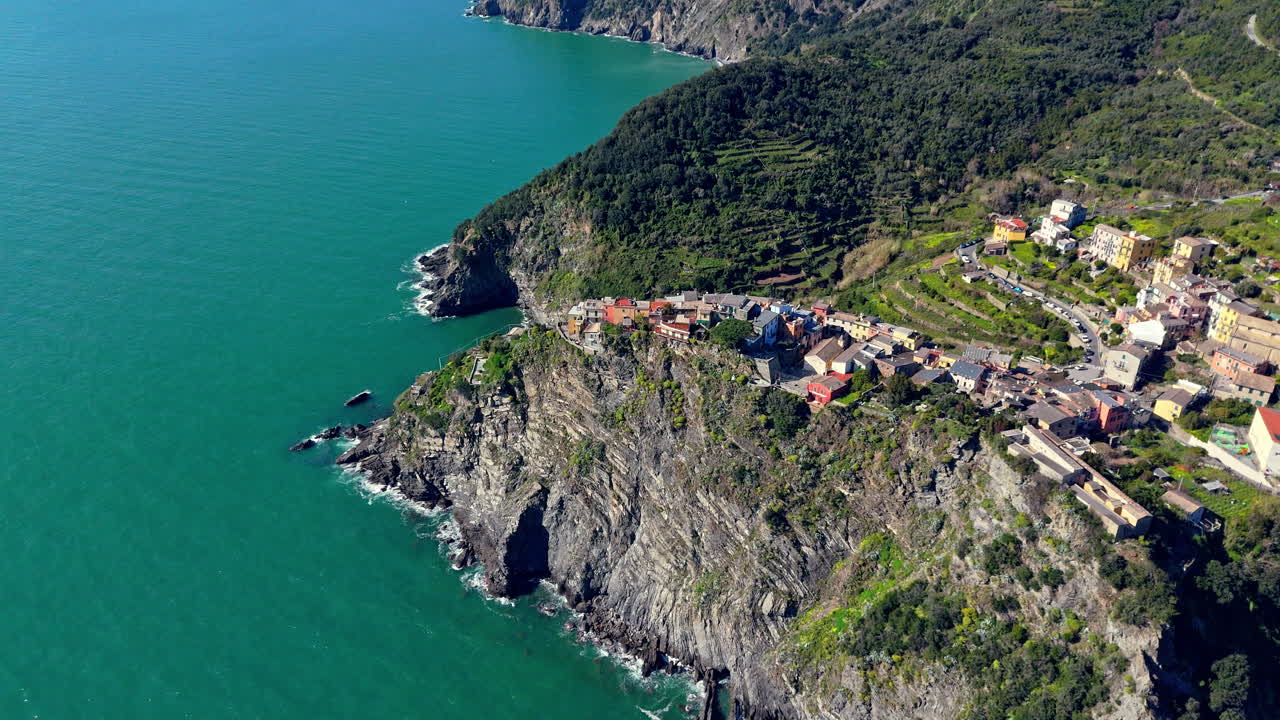 Picturesque view of Corniglia, Cinque Terre, Italy, with coastline and village