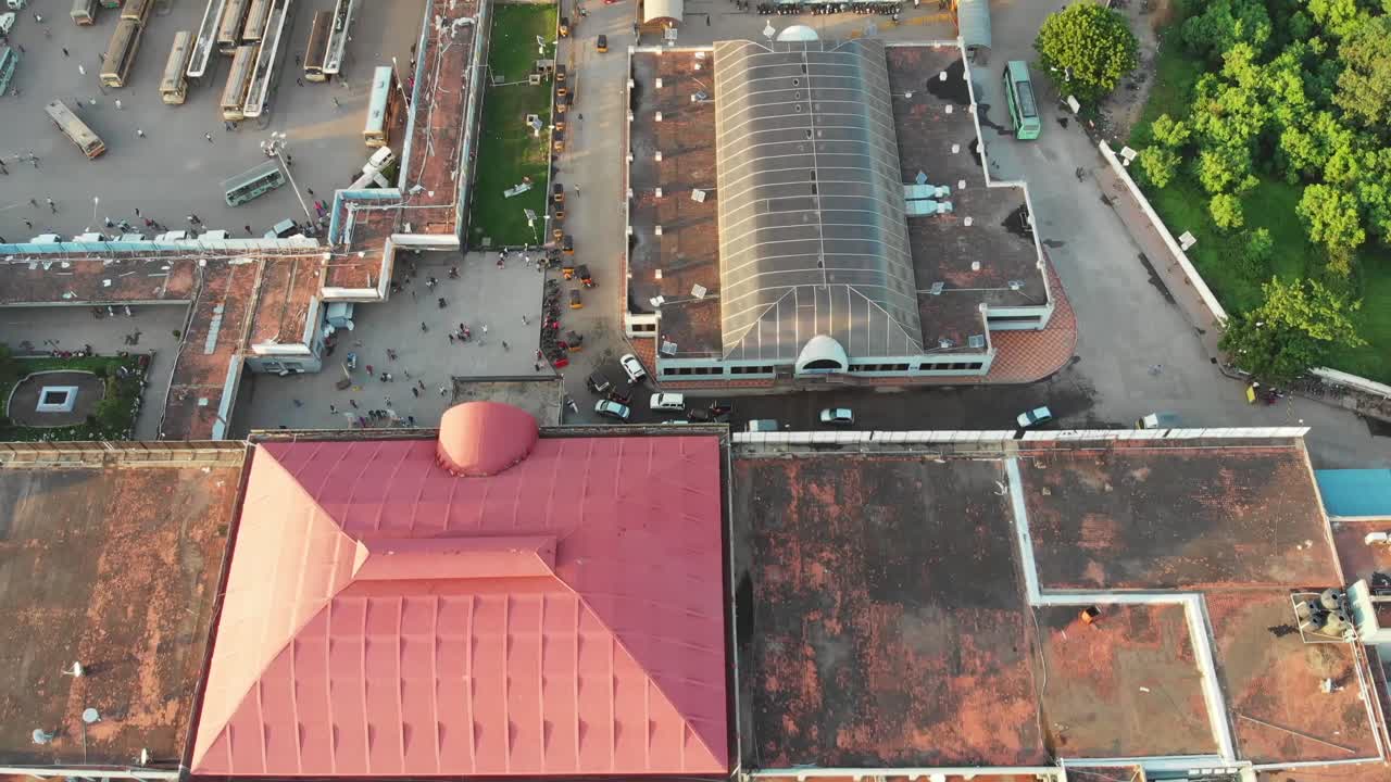 Aerial View of a Busy Bus Station and Metro Line in an Indian City