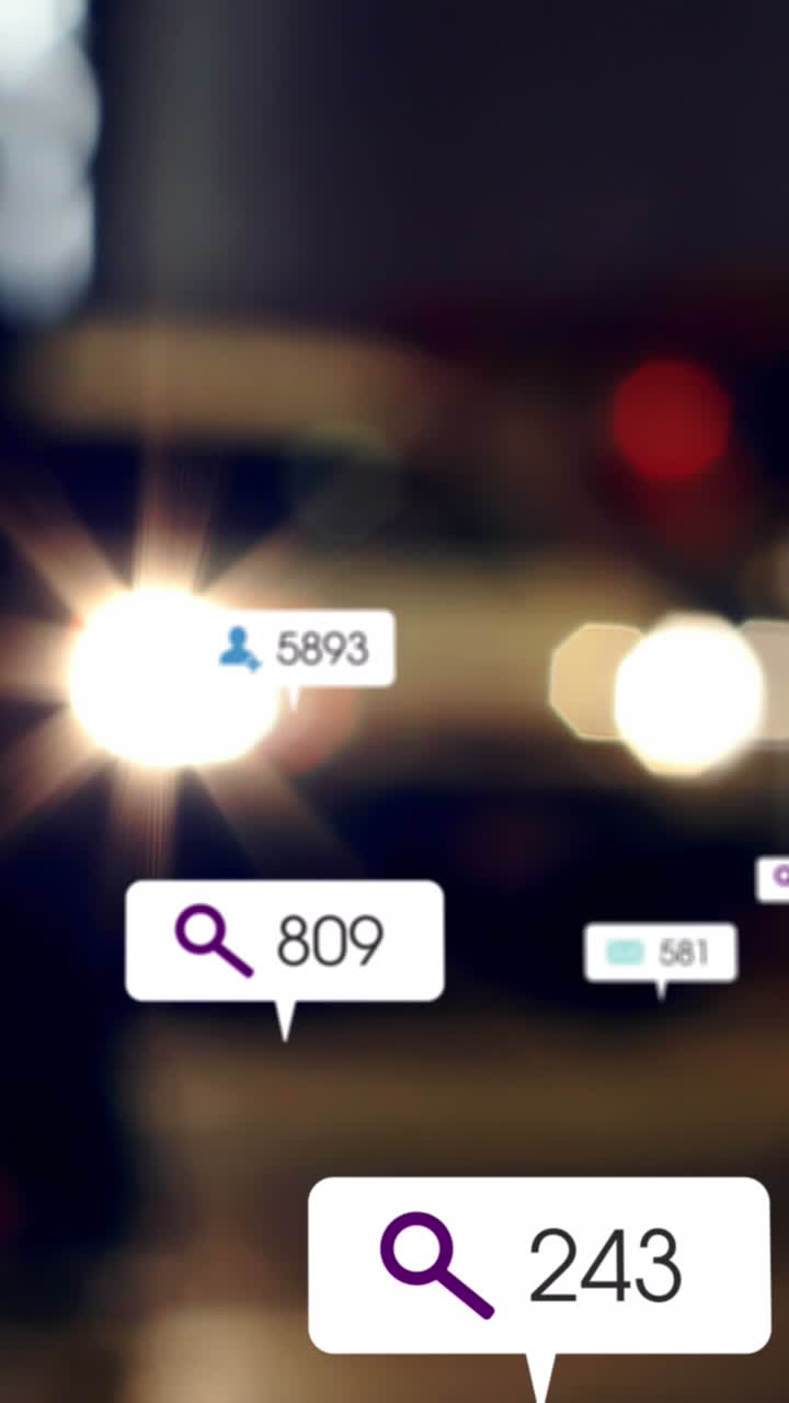 Animation of social media icons and numbers over out of focus city and traffic lights