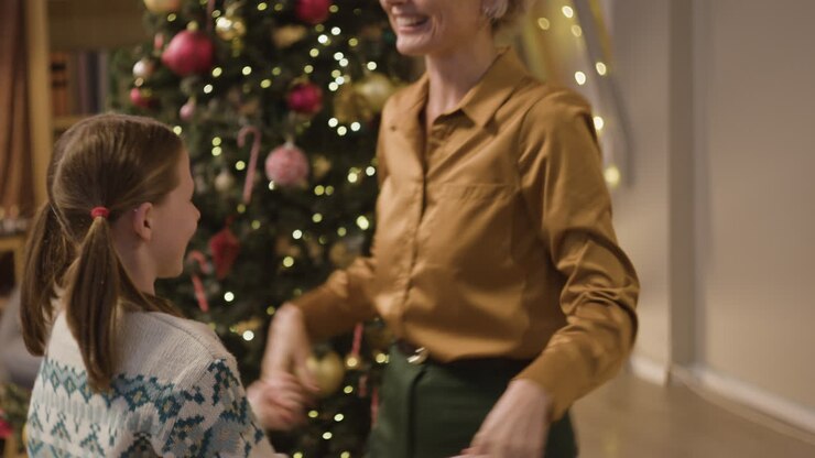 A mother and daughter joyfully celebrate Christmas together
