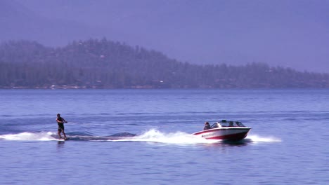 a water skier moves across the clear waters of lake tahoe nevada