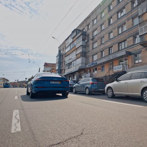 audi in blue color on street. audi e-tron on road during test drive