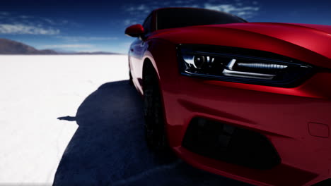 red sports car on salt flat