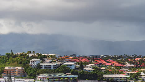 a sudden cloudburst sheds rain over the picturesque capital of nouméa on the french island of new caledonia - static time lapse