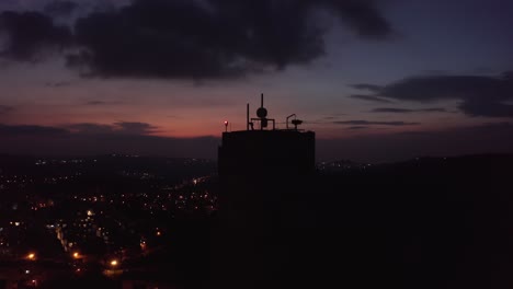 city silhouette at dusk with tower