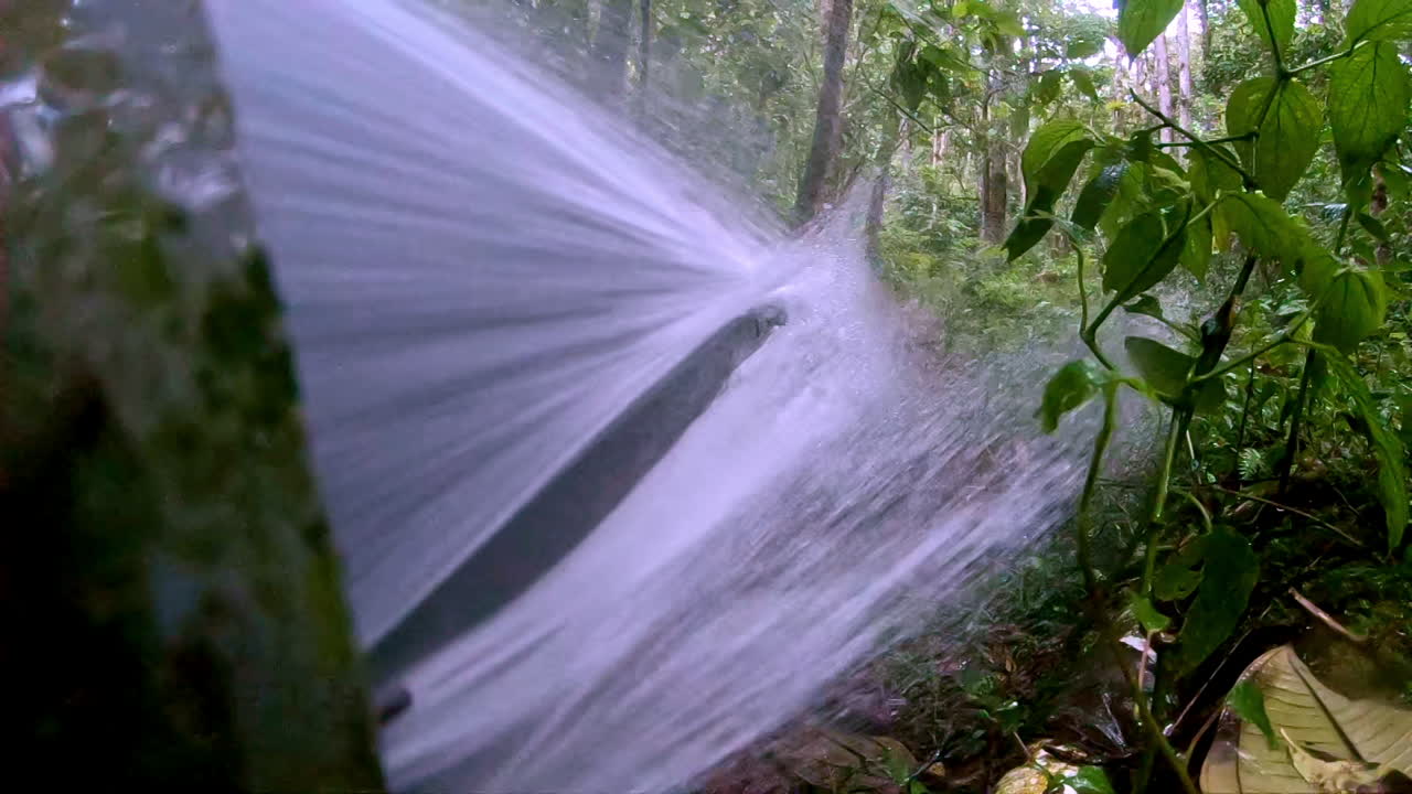 slow motion water pipe leaking water at high pressure 2