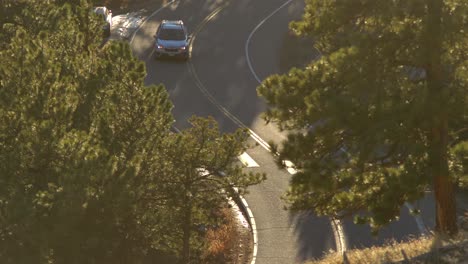 aerial view of car driving in the mountains