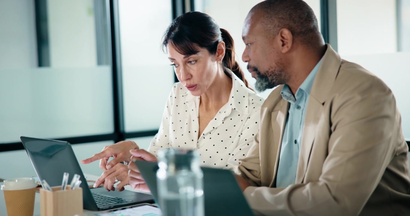 Diverse Business Colleagues Collaborating on a Project in an Office