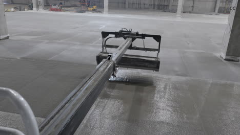 pouring concrete floor in large industrial building