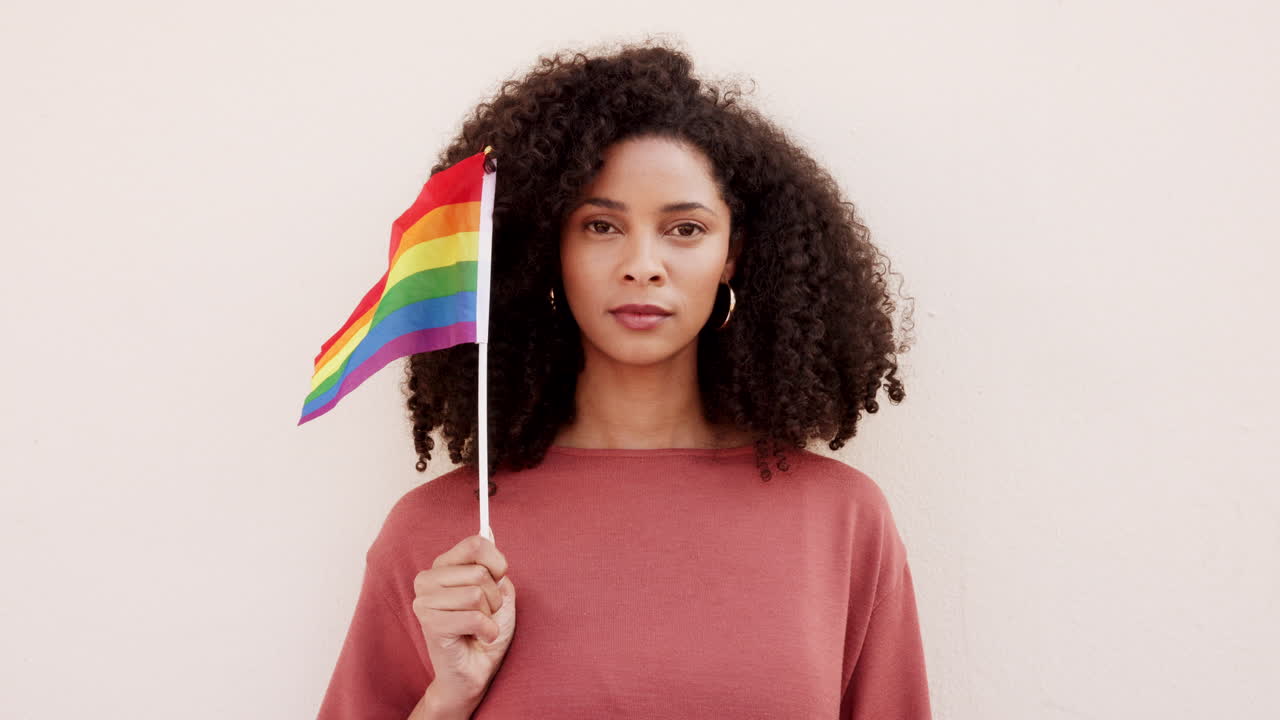 Black woman waving flag, rainbow