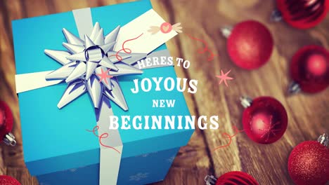 Animation-of-christmas-greetings-text-over-christmas-present-and-decoration