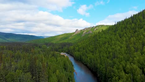 4k drone video of mountains and blue sky above chena river at angel rocks trailhead near chena hot springs resort in fairbanks, alaska