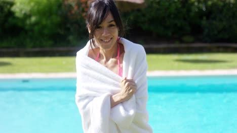 pretty friendly young woman wrapped in a towel