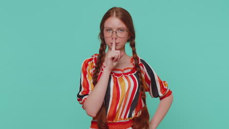 Girl-presses-index-finger-to-lips-makes-silence-gesture-sign-do-not-tells-secret,-shh-be-quiet